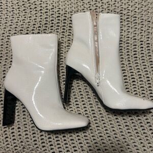 White patent snakeskin print heeled booties